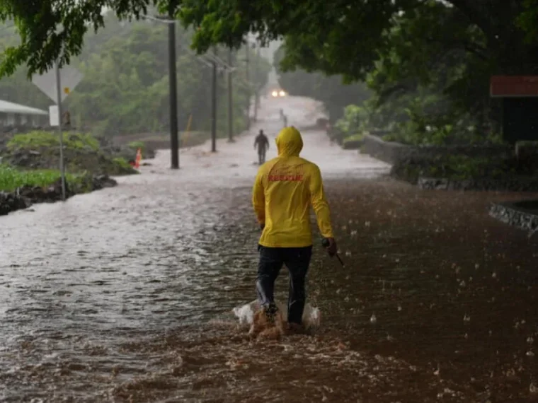 Storm clouds over Hawaii as residents recover from repeated hurricanes and flooding